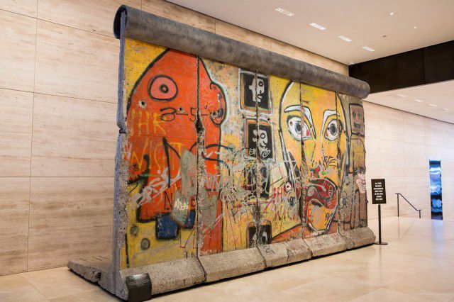 A CHUNK OF THE BERLIN WALL (520 Madison Ave)No one ever expects to walk into the lobby of an office building and find themselves face-to-face with a 20-foot-long section of the Berlin Wall, but sometimes, it just happens anyway. The 33,000 pound wall segment was brought to Manhattan in 1990 by real estate mogul Jerry Speyer, who initially placed it in the plaza behind 520 Madison Avenue at 53rd Street. It was removed for what the Times described as a "painstaking conservation job" before being returned last year, placed this time immediately inside the buildingâs lobby. It suffered some other indignities, like being splashed gently with mist from an adjacent waterfall, causing the concrete to crack and some of the paint to flake off. When a chunk finally fell off the base, the entire thing was shipped off to New Jersey for restoration. Asked about the wall, one man working behind the building's front desk put it like this: "When you have over $4 billion, you can have whatever you want." Ain't that the truth. 